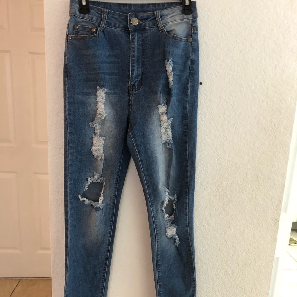 High waisted ripped blue jeans.